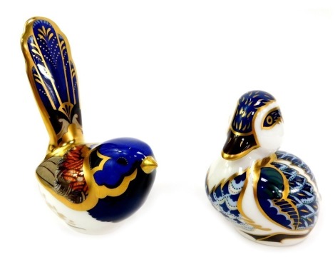 Two Royal Crown Derby porcelain bird paperweights, comprising Fairy Wren, red printed marks and gold stopper, 10cm high, and Sitting Duckling, red printed marks and gold stopper, 7cm high, both boxed.