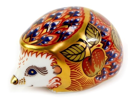 A Royal Crown Derby porcelain orchard hedgehog paperweight, an exclusive for the Royal Crown Derby Collectors Guild, red printed marks and gold stopper, 5.5cm high, boxed.