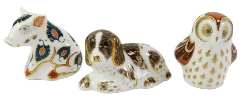 Three Royal Crown Derby porcelain paperweights, comprising Snuffle, Scruff and Owlet, each with red printed marks and gold stoppers, each boxed.