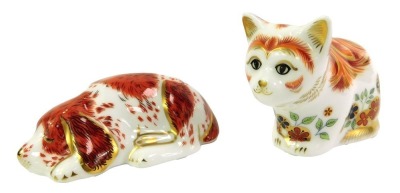 Two Royal Crown Derby porcelain paperweights, comprising Puppy, an exclusive for the Royal Crown Derby Collectors Guild, red printed marks and gold stopper, 9cm long, and Spice, Collectors Guild kitten, red printed marks and gold stopper, 6cm...