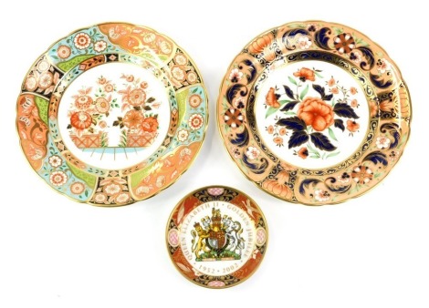 Two Royal Crown Derby porcelain plates, decorated in the Regency Flowers pattern, and the Derby Pink Carnelias pattern, each 21.5cm diameter, boxed, together with a Royal Worcester Elizabeth II Golden Jubilee commemorative trinket dish, 11cm...