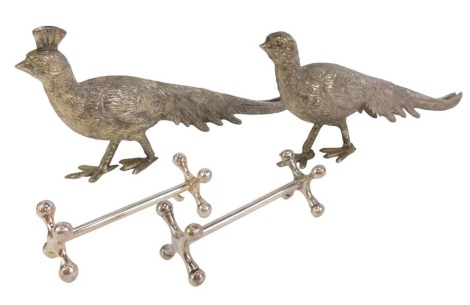 A pair of cast metal menu holders, modelled as pheasants, 23cm long, together with a pair of knife rests.