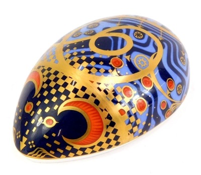 A Royal Crown Derby porcelain computer mouse paperweight, red printed marks and gold stopper, 11cm long.