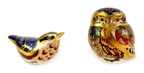 Two Royal Crown Derby porcelain paperweights, modelled as a nuthatch, 5cm high, and owl, 8.5cm high, each with red printed marks and silver stoppers.