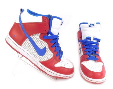 A pair of Nike Dunk trainers, in red and blue, size UK 7.5.