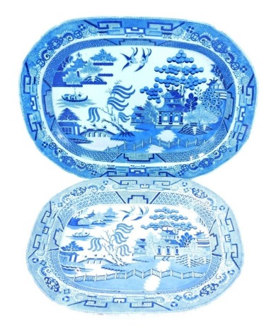 A 19thC blue and white willow pattern oval platter, 52cm wide, and a Staffordshire ironstone Willow pattern dish, 43cm wide.