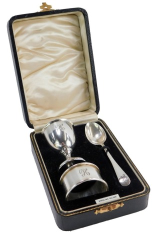 A George VI cased silver Christening set, comprising egg, spoon and napkin rings, each bearing the initial H, maker DP & Co, Birmingham 1939, 1.37oz.