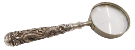 A Chinese magnifying glass, with a white metal dragon carved handle, with stainless steel framed magnifier, unmarked, 15cm long.