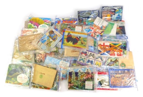 Various cigarette and tea cards, in albums, to include Brooke Bond Prehistoric Animals, PG Tips Woodland Wildlife, John Player and Sons Cricketers 1938, John Player National Flags and Arms, together with Cricket Memorabilia Society cards, etc. (1...