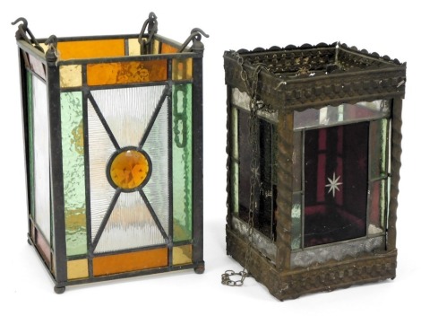 An early 20thC leaded stained glass lantern, of square form, in green, orange and yellow, 30cm high, another stained glass lantern. (2)