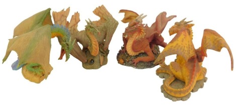 Four Danbury Mint dragon figures from the Treasure Dragons series, comprising Verendi serial number 539, Draco serial number 415, Petvarnathian serial number 450, and Slorn-Dranbar serial number 685, each approx 17cm high, boxed.