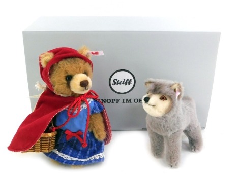 A Steiff Fairytale World Little Red Riding Hood and the Wold set, in alpaca wool, number 747, 16cm and 13cm high respectively, with certificate, boxed with outer packaging.