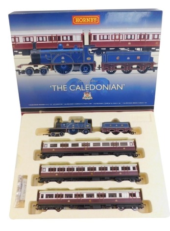 A Hornby The Caledonian OO gauge set, comprising Caledonian Railway 4-2-2 123 locomotive, composite coach 460, composite coach 461 and brake coach 142, boxed.