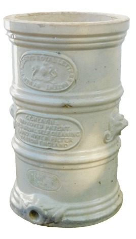 A stoneware water filter, stamped Her Majesty's Royal Letters, on cream finish with lion mask handles, 41cm high, 26cm diameter.