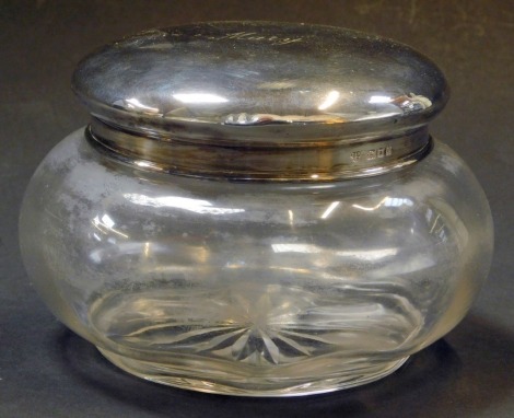 A George V cut glass and silver topped dressing table jar, of large proportions, bearing inscription Mary, on star base, maker C&R, London 1922, 8cm high.