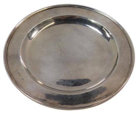 A Victorian silver salver, with ribbed border and inset tray, maker CB, London 1863, 23cm diameter, 10.86oz.