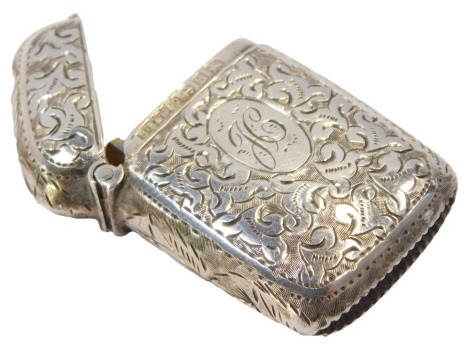 A Victorian silver Vesta case, with engraved foliate decoration, oval reserve, initial engraved, Birmingham 1892.