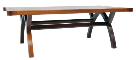 A modern bespoke walnut coffee table, rectangular top raised on arched support united by stretchers, the stretcher carved with a bee, 44cm high, the top 130cm x 72cm.