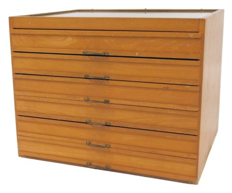 A beech tabletop haberdashery cabinet, the top with a glass panel, base with six drawers, each enclosing various divisions, 37cm high, 47cm wide, 39cm deep.