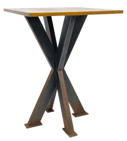 A modern high pub table, the square brass top with various rivets, on a X-shaped metal base, 108cm high, the top 80cm x 80cm.