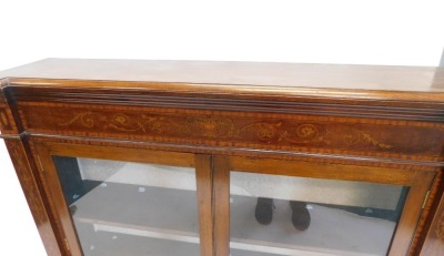 A late 19th/early 20thC mahogany satinwood and marquetry bookcase, the inverted break front top with a moulded edge, above an inlaid frieze, two glazed doors, on block feet, 114cm high, 126cm wide. - 3