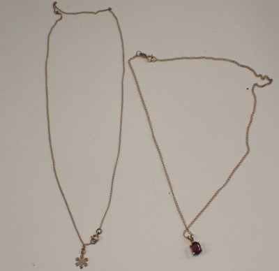 Two pendants and chains, comprising a 9ct gold fine link neck chain with a garnet set pendant, the pendant 1cm high, the chain 36cm long, and a further 9ct gold pendant and chain with cluster pendant, the chain 40cm long, 3.1g all in. (2) - 4