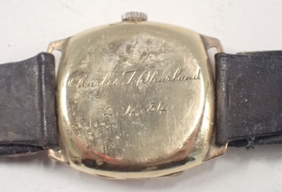 A Verity 9ct gold cased gent's wristwatch, the square set dial with circular dial and silvered back, with gold hands and seconds dial, the case inscribed Charles T Sharland 2.4.34, on a brown leather strap, 3cm diameter. - 3