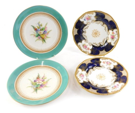 A pair of Coalport side plates, each decorated with flower sprays on a cobalt blue ground with gilt border, 20cm diameter, and a pair of floral dessert plates, each with a turquoise colour border, 23cm diameter. (4)