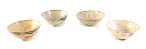 Four Chinese pottery blue and white bowls, each decorated in underglaze blue, the largest 13cm diameter, the smallest 11.5cm diameter.