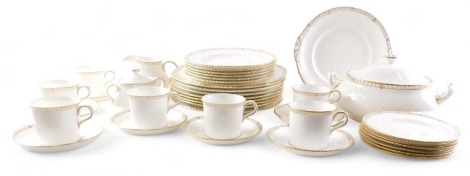 A Royal Crown Derby Prince Consort pattern part dinner and tea service, in plain white with gilt borders, to include tureen, cups, saucers, dinner plates, etc.