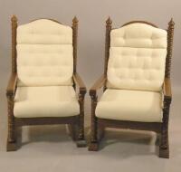 A pair of continental oak throne type armchairs