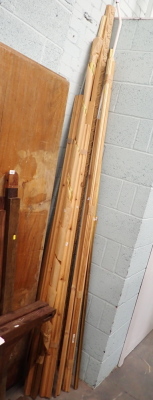 A group of pine rails, picture framing, gilt metal rails, etc. (a quantity)