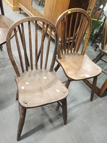 Two oak stick back chairs.