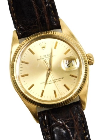 A Rolex 18ct gold cased Oyster Perpetual date gentleman's wristwatch, circular dial with gold batons, centre seconds, marked superlative chronometer, officially certified, on a leather non Rolex strap.