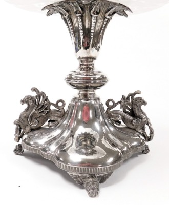 A Victorian silver plate and cut glass table centrepiece, with a fluted trumpet, above two tier glass dishes engraved with acorns and oak leaves, raised on a quatrefoil base, with griffin handles, on four scroll feet, 74cm high. - 2