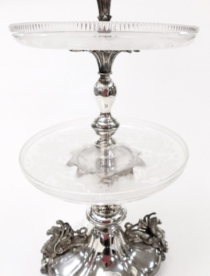 A Victorian silver plate and cut glass table centrepiece, with a fluted trumpet, above two tier glass dishes engraved with acorns and oak leaves, raised on a quatrefoil base, with griffin handles, on four scroll feet, 74cm high. - 3