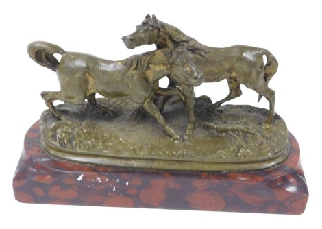 After Pierre-Jules Mene (French 1810-1879). "Accolade", a gilt bronze sculpture of horses, on a red marble base, 14cm wide.