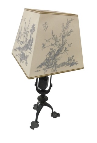 A Victorian Arts and Crafts cast iron gimbal table lamp, with a later shade, 48.5cm high.