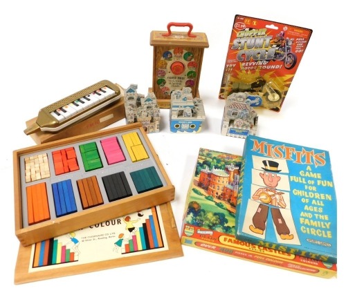 A group of games and toys, comprising Cuisenaire Number in Colour, boxed, a Chopper stunt cycle, Misfits, Belvoir Castle jigsaw puzzle, Fisher Price Tick-Tock teaching clock, a Melodica, and three Peter Lippman mini house books, comprising Mother Goose's