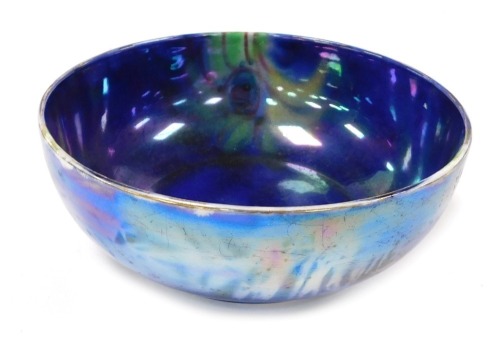 An early 20thC Burleigh ware blue lustre bowl, with floral and leaf decoration, printed and painted marks, 20.5cm wide.