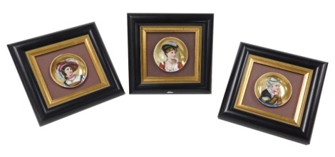 Three late 19thC Continental porcelain dishes, decorated with portraits of Renaissance ladies, within gilt and ebonised frames, 17.5cm 18.5cm.