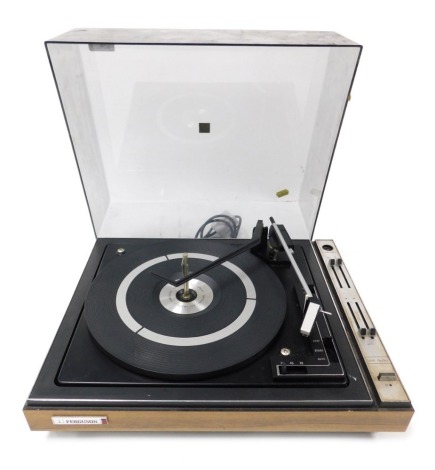 A Ferguson record player, model 3047, serial number 28515, cased, 43cm wide. Buyer Note: WARNING! This lot contains untested or unsafe electrical items. It is supplied for scrap or reconditioning only. TRADE ONLY