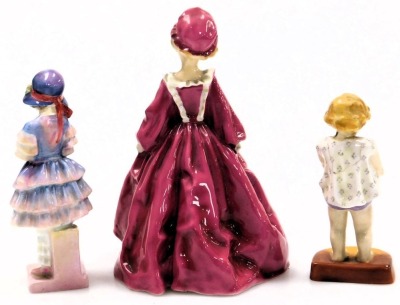 A Royal Worcester figure modelled as Grandmother's Dress, 3081, another modelled as Joan, 2915, and a Royal Doulton figure modelled as Pinkie, HN1559. (3)(AF) - 2