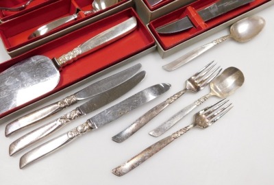 A group of Community Plate South Seas pattern flatware, including fish knives and forks, tablespoons, dessert spoons, cake slice, etc. (qty) - 2