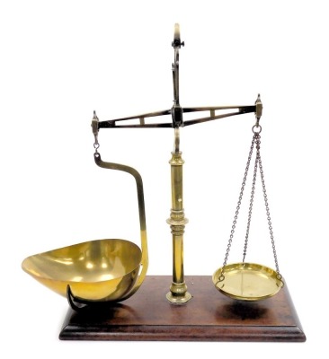 A set of Victorian brass balance scales, by Parnall & Sons of Bristol, raised on a mahogany base, 60cm high.