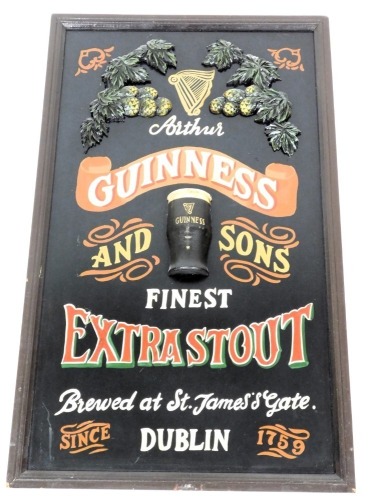 A Guinness wooden and plaster relief decorated advertising picture, 91cm x 54cm.