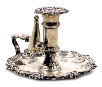 A George IV silver chamber stick, with snuffer, with a gadrooned foliate scroll and floral rim, S C Younge & Co., Sheffield 1823, 11.54oz.