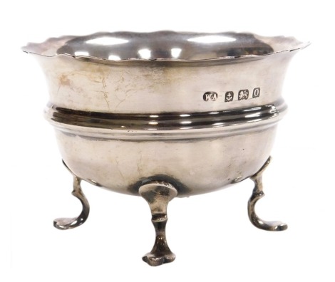 A George VI silver sugar bowl, monogram engraved, raised on three scroll feet, Birmingham 1938, 2.49oz.