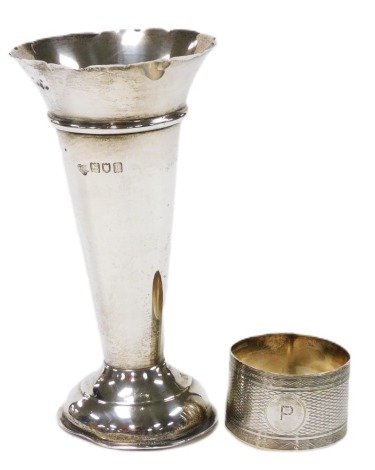 An Edward VII silver vase, of trumpet form, London 1905, and a silver napkin ring, with engine turned decoration, Birmingham 1929, 3.57oz.