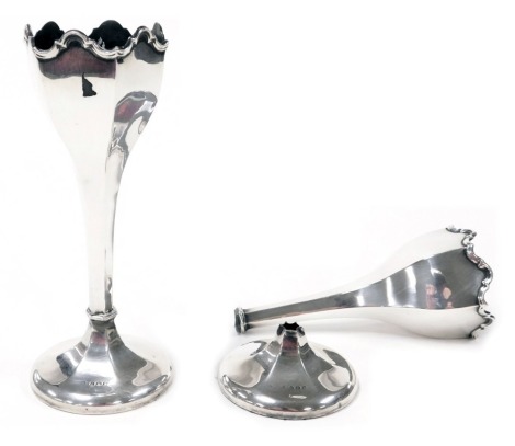 A pair of George V loaded silver bud vases, of hexagonal form, raised on a slender stem and outswept foot, Birmingham 1923, 18.26oz all in. (AF)